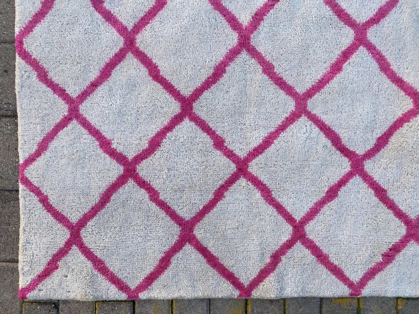 Moroccan Berber pink and white rug.